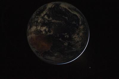Earth at night, thin crescent over Africa